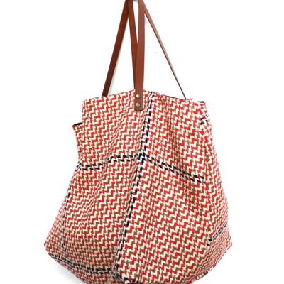 Bolso tote de tela gráfica azul, rojo, marrón con interior negro.