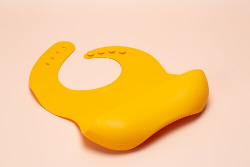 the SCOOP: silicone bib in MUSTARD
