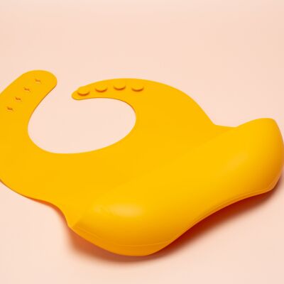 the SCOOP: silicone bib in MUSTARD