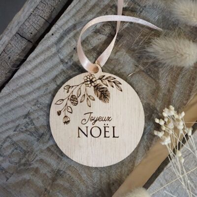 Palla di legno incisa con decorazioni natalizie