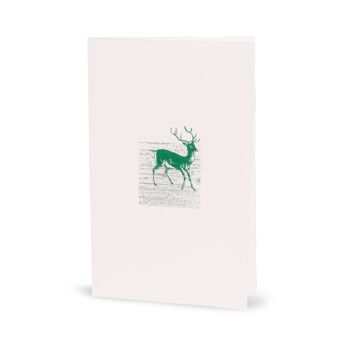 Carte de Noël d'hiver avec un cerf vert