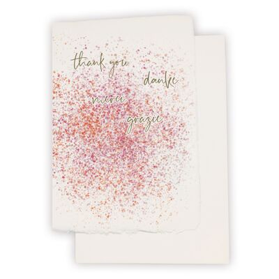 Tarjeta de papel hecha a mano "Gracias - danke - grazie - merci" con salpicaduras de pintura