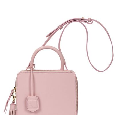 Pink leather shoulder bag with top handle and Leandra tassel.