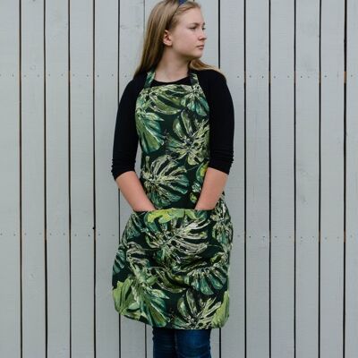 Delantal con tema botánico para mujer con estampado de hojas verdes y dos bolsillos delanteros