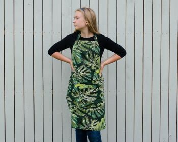 Tablier à thème botanique pour femme avec des motifs de feuilles vertes et deux poches avant 2