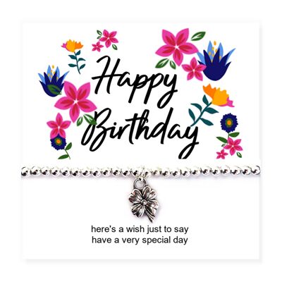 Tarjeta de mensaje y pulsera de flores de feliz cumpleaños
