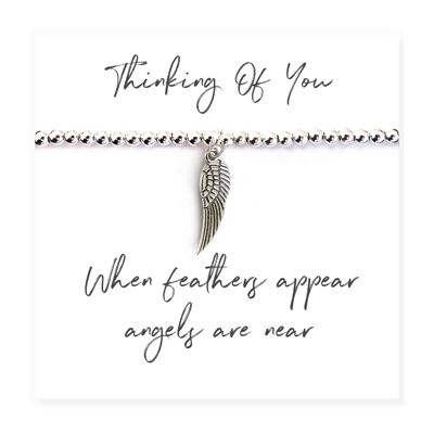 Pulsera con cuentas de plata con plumas de ángel en tarjeta con mensaje