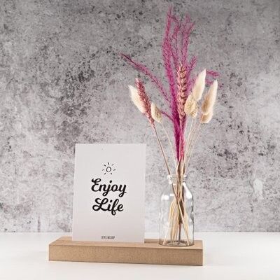 Cardboard with card and vase Enjoy life
