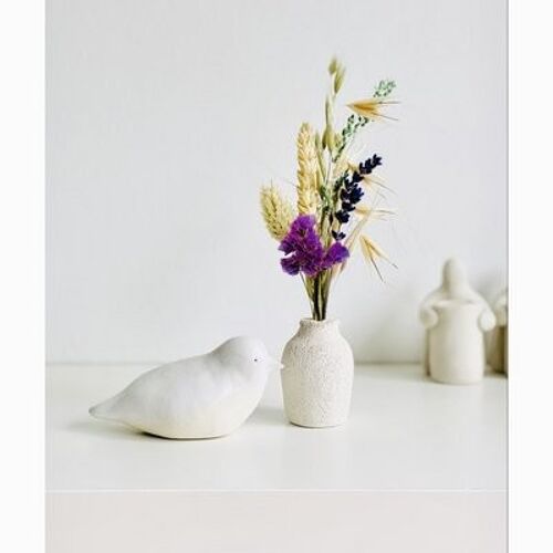 Ceramic bird + ceramic vase with dried flowers