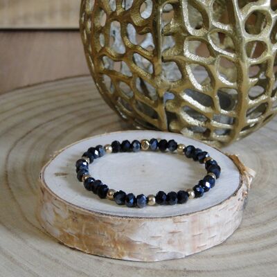 Pulsera de cuentas de cristal negro y hematitas doradas