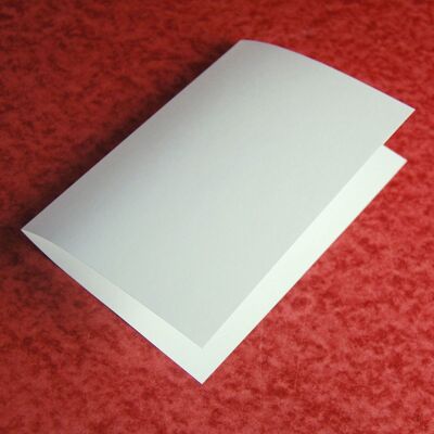 100 off-white insert sheets 16.3 x 22.4 cm