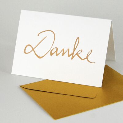 10 tarjetas para agradecer: tarjetas dobladas con sobres dorados