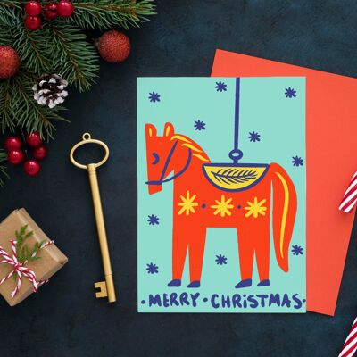 Cartolina di Natale con ornamento dell'albero del cavallo