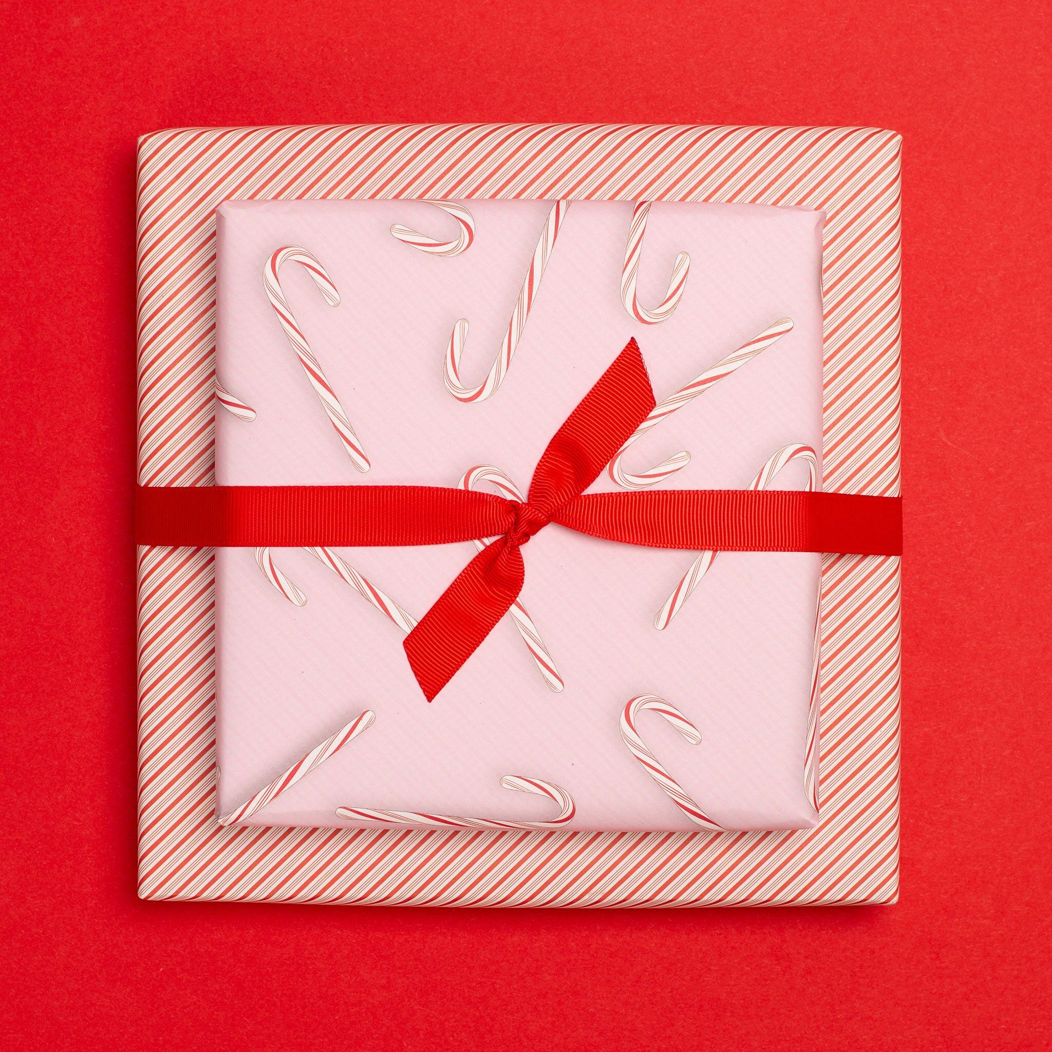 Double-sided Christmas wrapping paper "Candy Canes" Candy Canes in pink and red made from 100% recycled paper "Candy Canes" - pink - double-sided