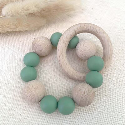 Green teething rattle in silicone and beech wood