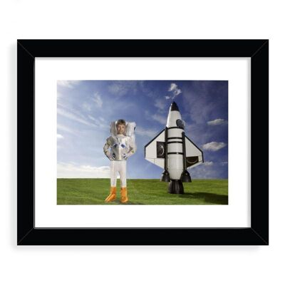 Boy dressed as an astronaut Designer Framed Art Print