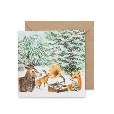 Cartolina di Natale con scena di bosco innevato