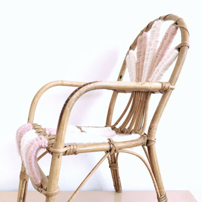 Vintage children's chair in woven rattan