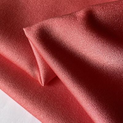 Pale orange crepe satin fabric