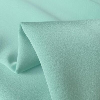 Light green acetate crepe fabric
