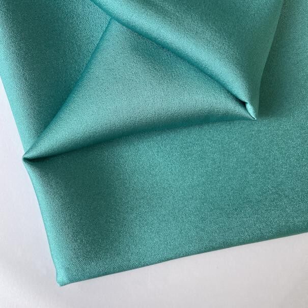 Tessuto di raso pelle d'angelo turchese
